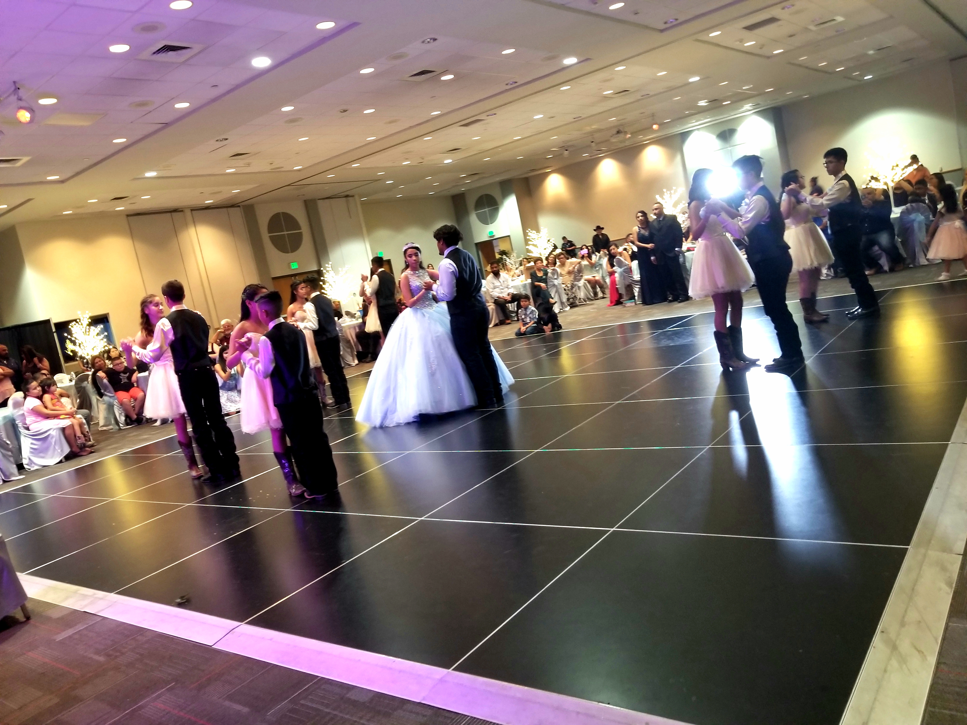 Quinceañera court performing at the event